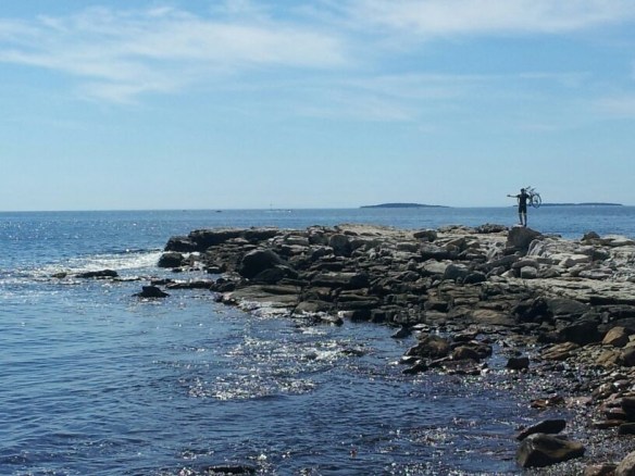 Jordan holding bike at Seawall